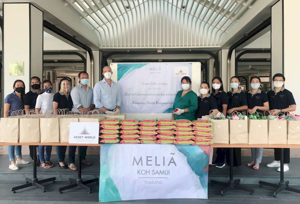 Masked up, the resort's staff have funded and distributed packs brimming with essential items such as rice, noodles, cooking oil, milk, tinned food and more to people in need in their local community during the pandemic.— Photo by Melia