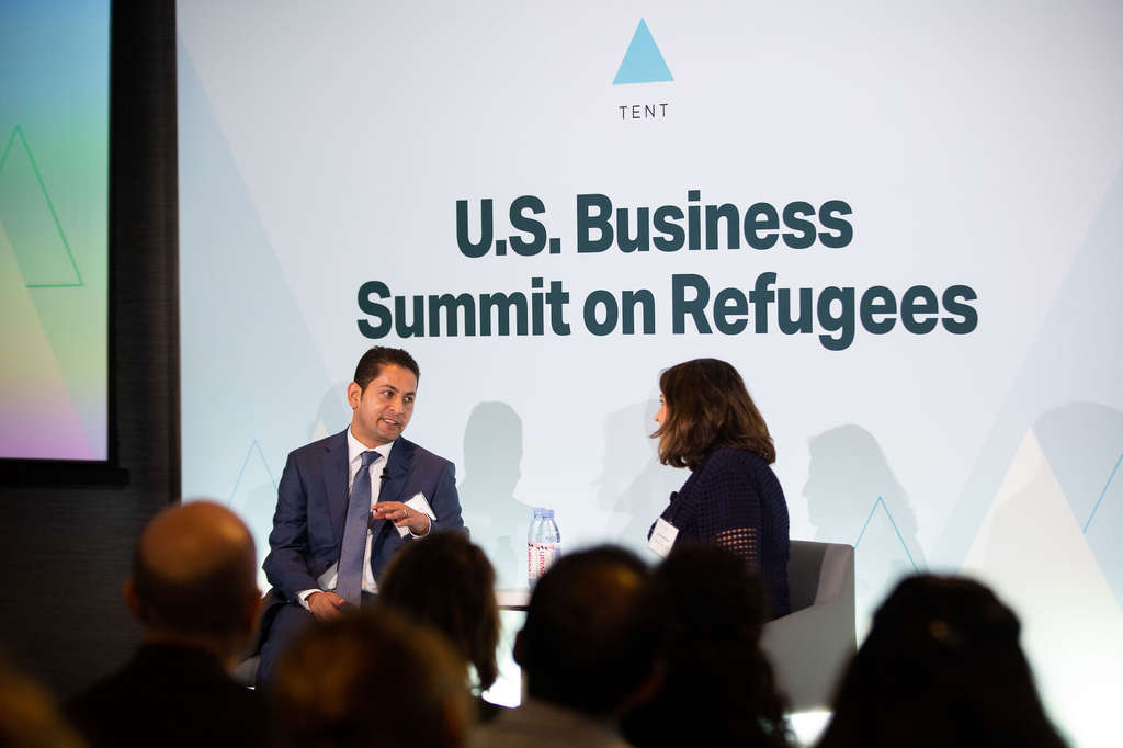 Abdul Nasir Rahimi, safety and security manager at Hilton McLean, shares his experience coming to the U.S. as an Afghan refugee with Julieta Valls Noyes, Assistant Secretary of State for Population, Refugees and Migration.— Photo by Hilton