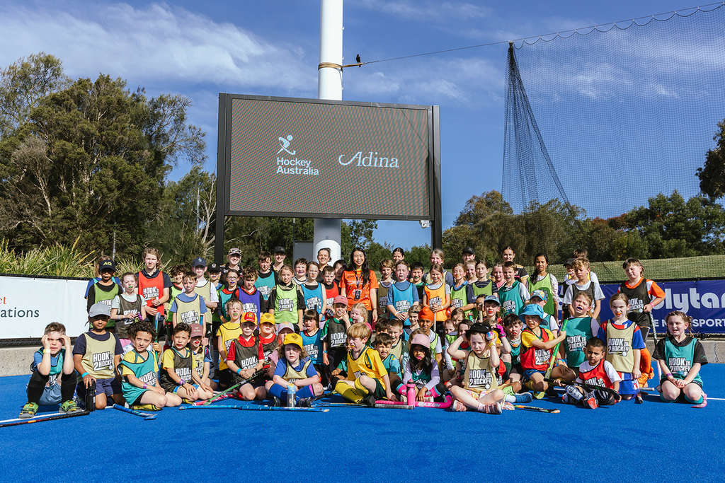 Adina’s Amanda Halim hooks into hockey with some young fans at the Adina Community Clinic. — Photo by TFE Hotels